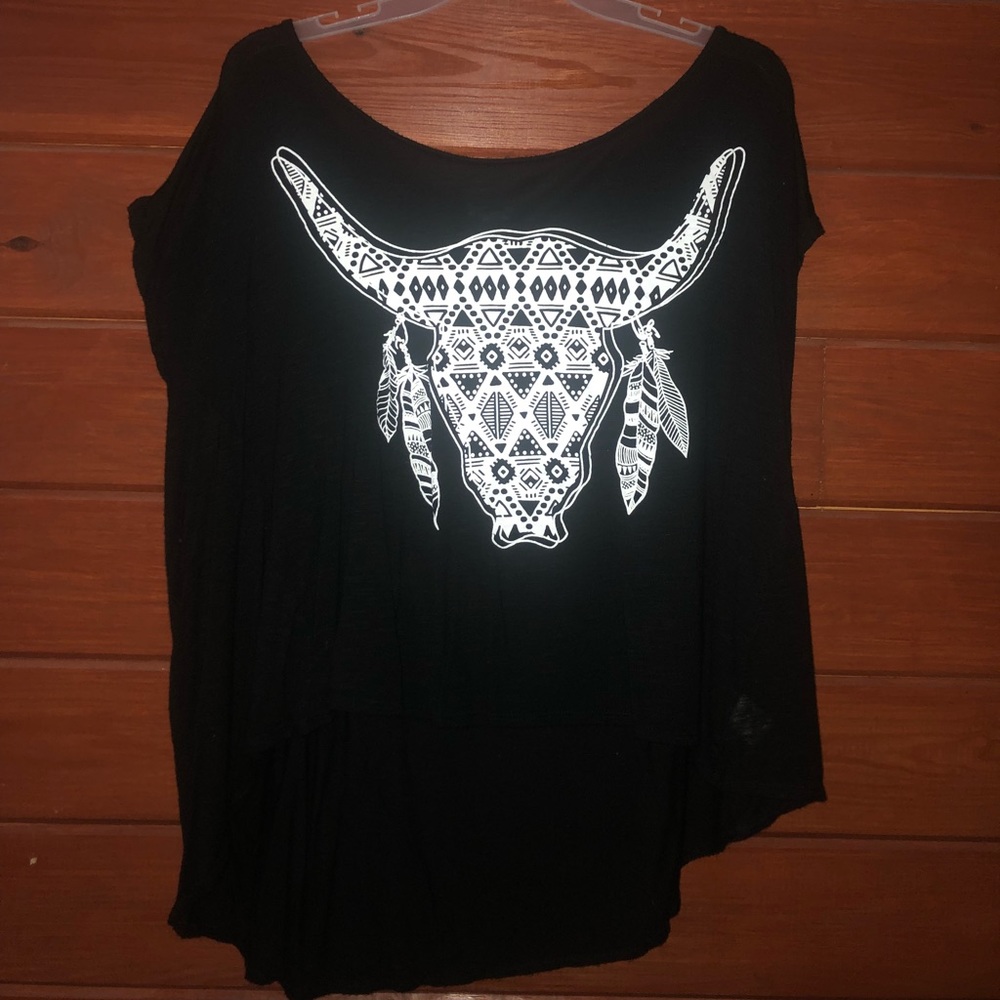 Black shirt, white cow